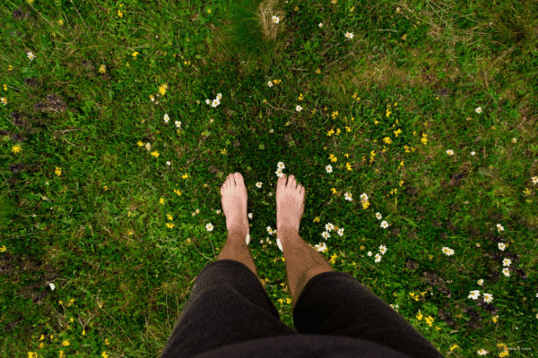Grounding In the Earth with feet in the grass and soil